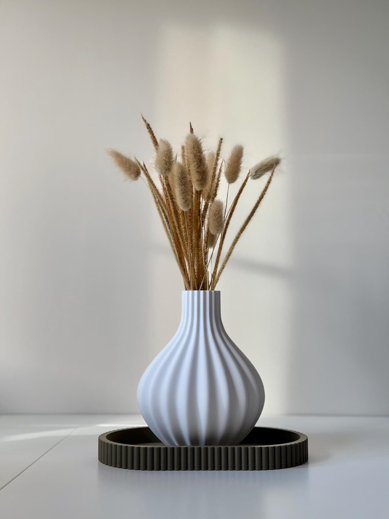 Bloom Vase in Ivory with dried grasses on an Olive Arc Tray